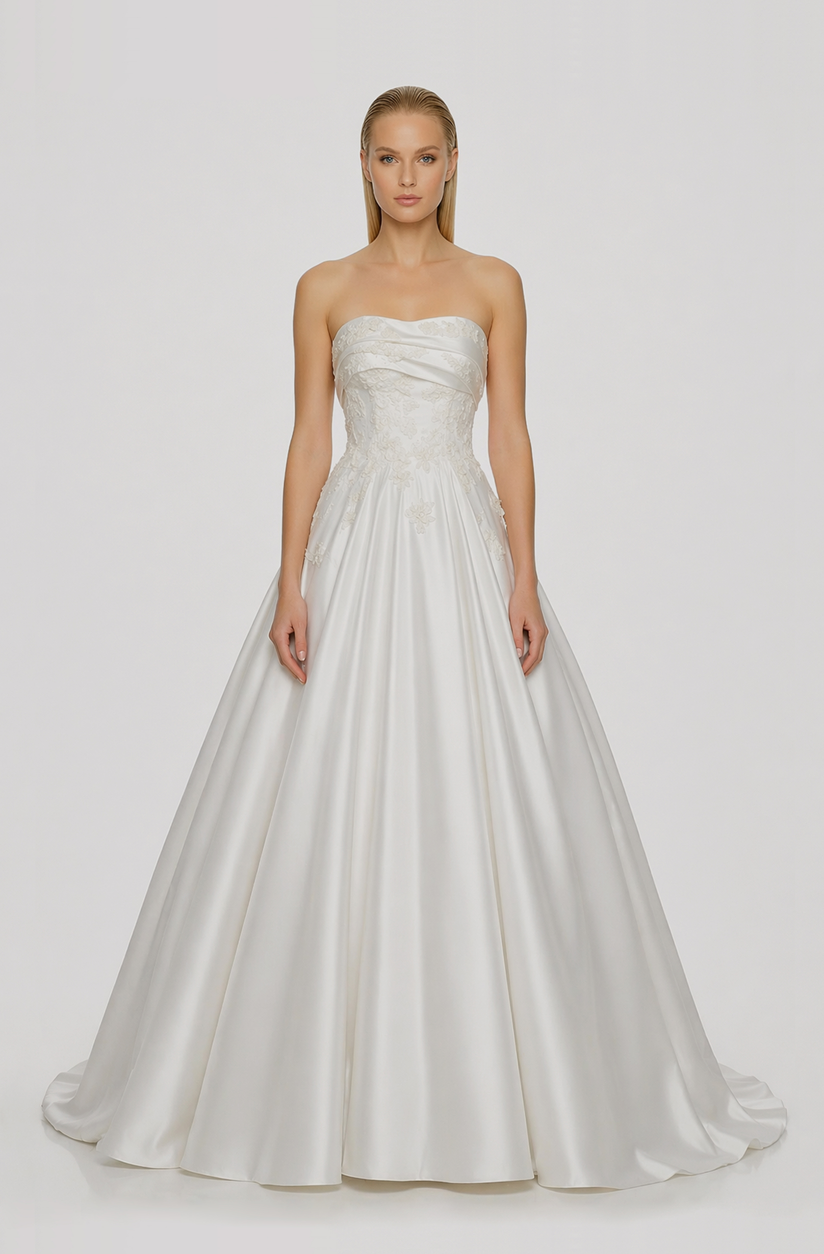 Front view of a woman in an Off-white bridal satin ball gown with draped lapel and corded lace applique 19, image 1