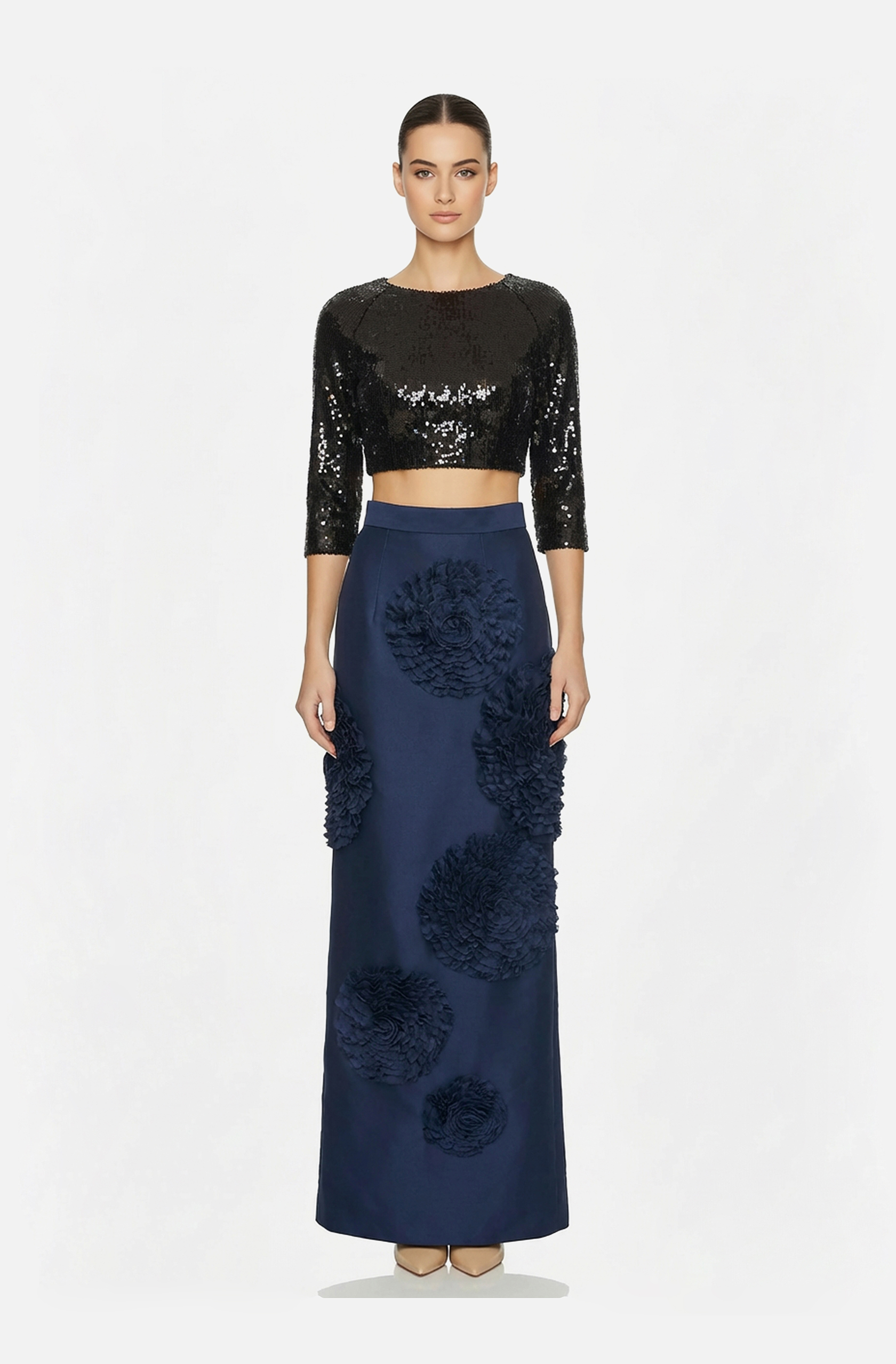 Front view of a woman in a Black sequin crop top and navy Mikado long skirt with hand-stitched rosette accents 23, image 1