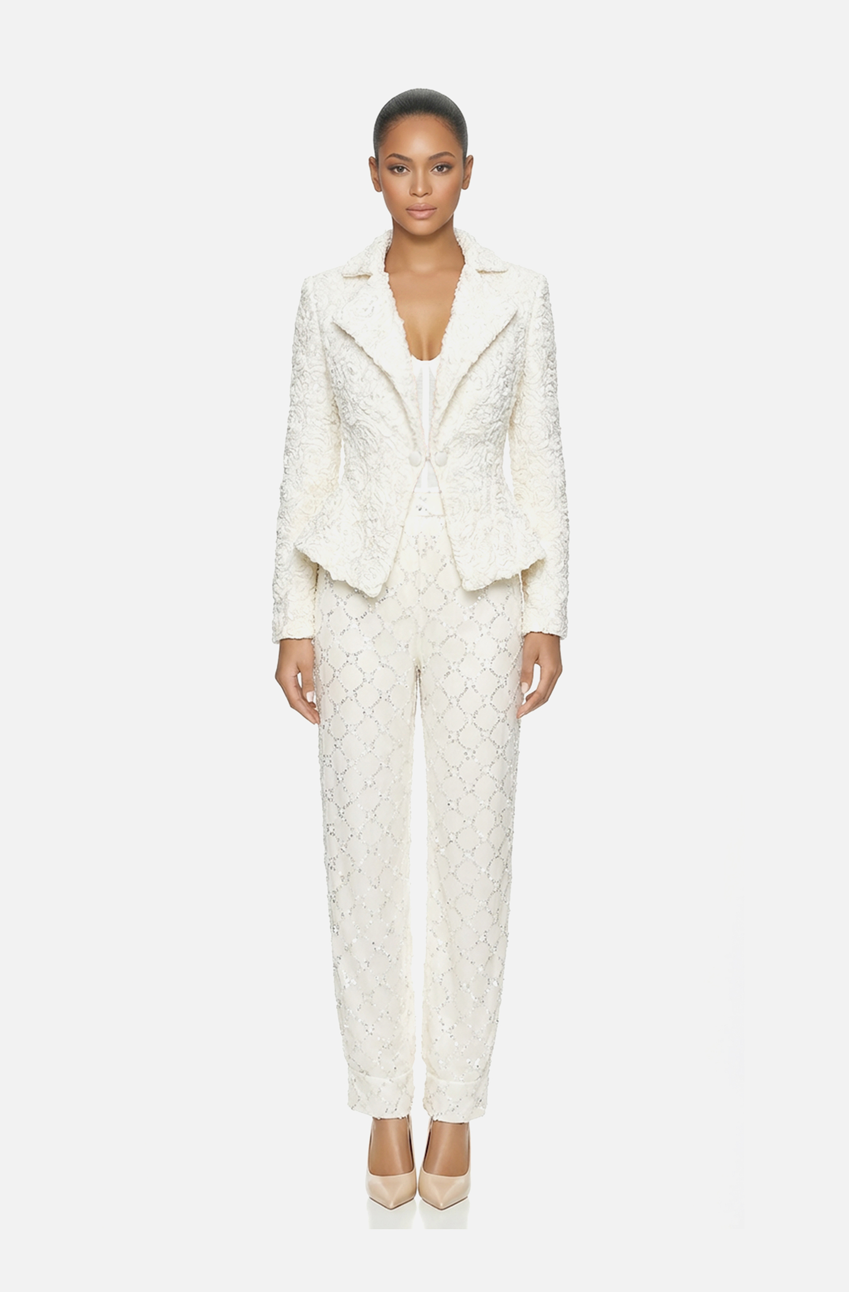 Front view of a woman in an Off-white three-piece ensemble of hand-draped tulle corset, beaded harem pants, and ribbon floral-patterned jacket 42, image 1